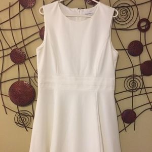 Sleeveless white dress, plus size.